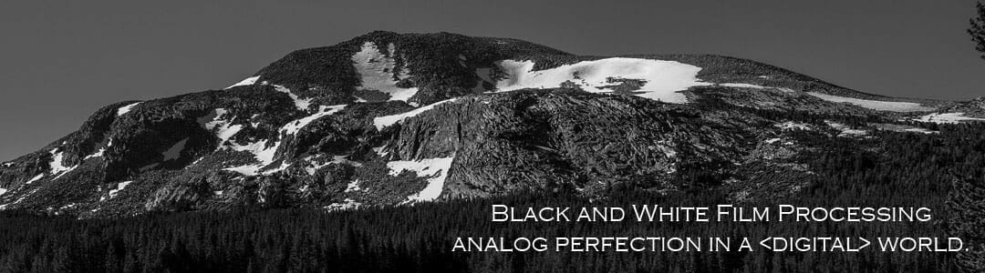 Black and white film photo of mountains.
